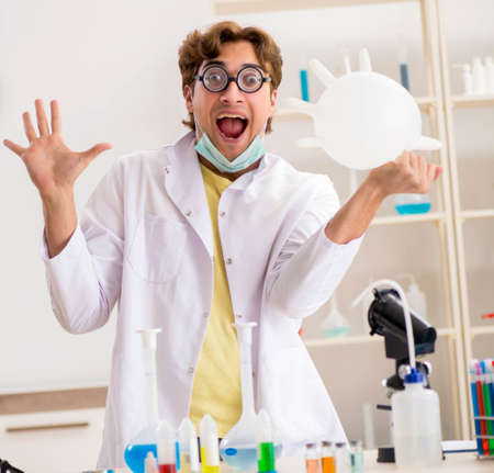 Funny crazy chemist doing experiments and testsの写真素材