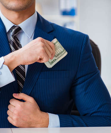Businessman receiving his salary and bonusの写真素材