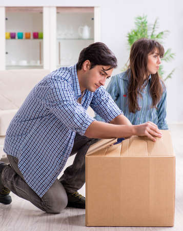 Young family moving in to new apartment after paying off mortgagの写真素材