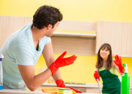 Young couple working at kitchen