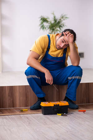 Young male carpenter working indoorsの写真素材