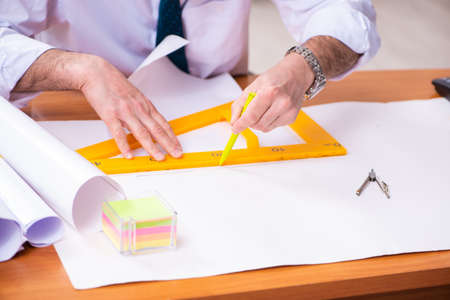Two male architects working in the office
