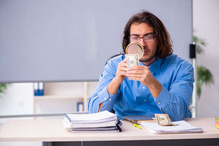 Young male teacher in the classroomの写真素材