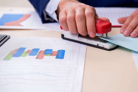 Young male financial manager in the officeの写真素材