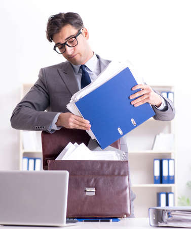 Employee with too much work taking it homeの写真素材