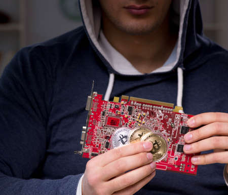 Young man in bitcoin mining concept