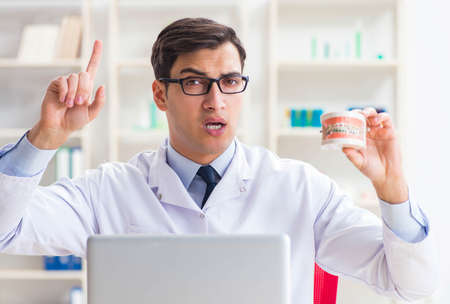 Young dentist working in the dentistry hospitalの写真素材
