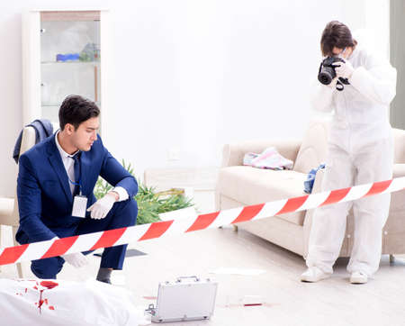 Forensics investigator at the scene of office crimeの写真素材