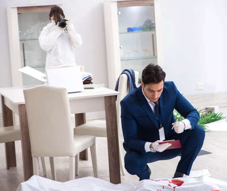 Forensics investigator at the scene of office crimeの写真素材