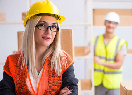 Delivery contractor delivering boxes to officeの写真素材