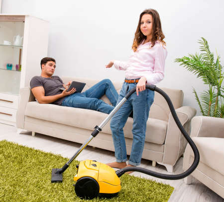 Young family doing cleaning at homeの写真素材
