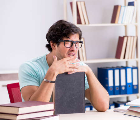 Young handsome student preparing for school examsの写真素材
