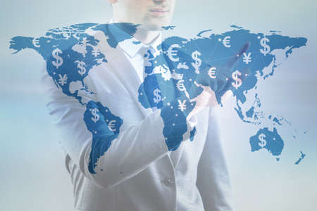 Global money transfer and exchange concept with businessmanの写真素材