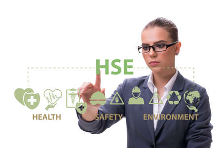 HSE concept with businesswoman pressing virtual buttonの写真素材
