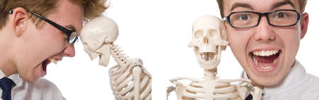 Funny doctor with skeleton isolated on whiteの写真素材