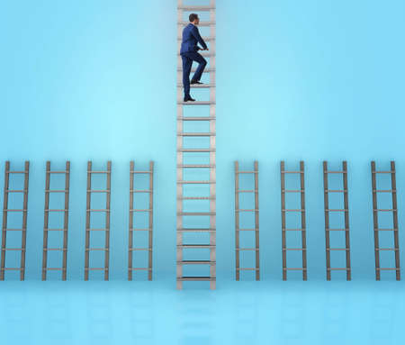 Businessman climbing career ladder in business success conceptの写真素材