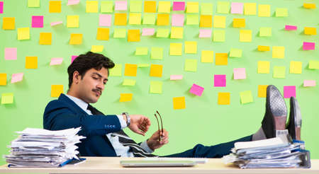 Businessman having trouble with his prioritiesの写真素材