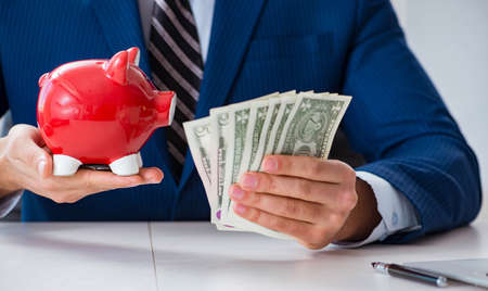 Businessman thinking about his savings during crisisの写真素材