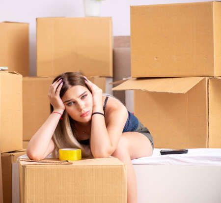 Young woman moving to new placeの写真素材