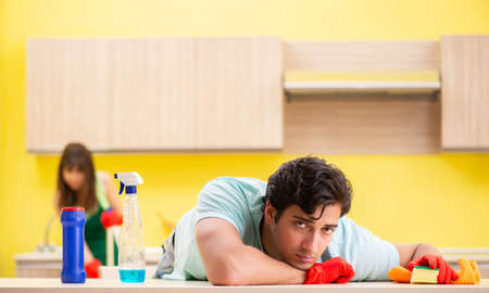 Young couple working at kitchen