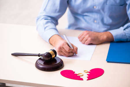 Young man in courthouse in divorcing conceptの写真素材
