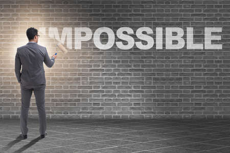 Businessman in impossible business conceptの写真素材