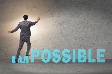 Businessman in impossible business conceptの写真素材