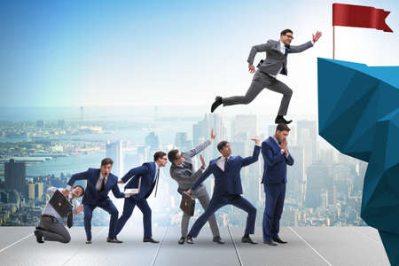 Career progression concept with businessman climbing stairs