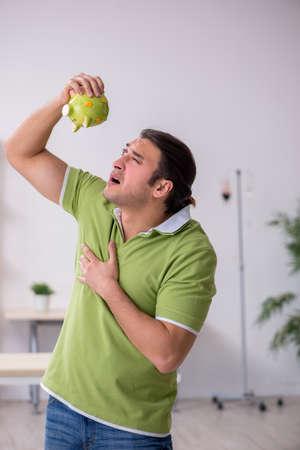 Young man waiting for doctor in the clinicの写真素材
