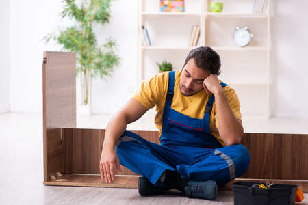 Young male carpenter working indoorsの写真素材