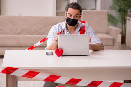 Young man in love during pandemic diseaseの写真素材