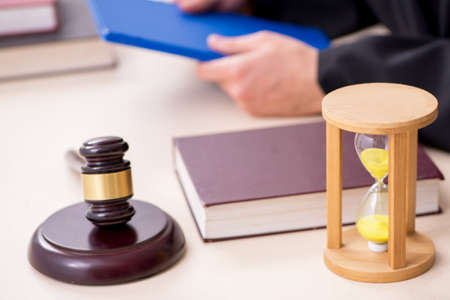 Young male judge in time management concept