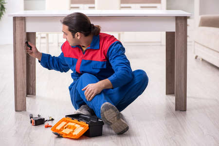 Young male carpenter working indoorsの写真素材