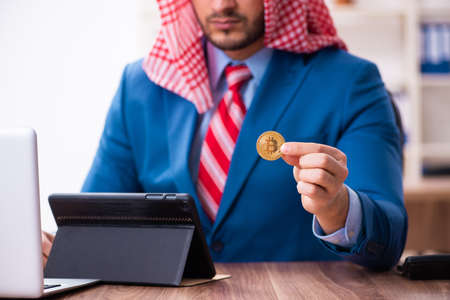 Young male arab employee working in officeの写真素材