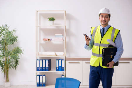 Young male architect working in the office