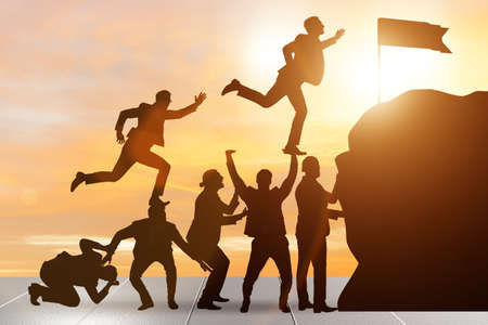 Career progression concept with businessman climbing stairsの写真素材