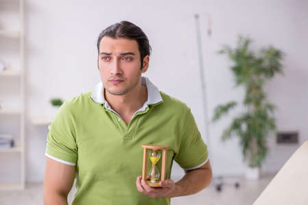 Young man waiting for doctor in the clinic