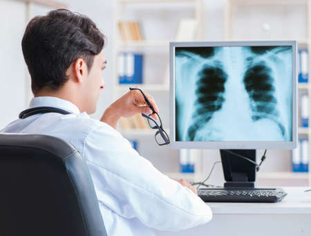 Doctor radiologist looking at x-ray images