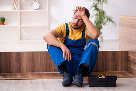Young male carpenter working indoorsの写真素材