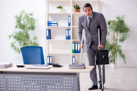 Young male employee after accident at workplace