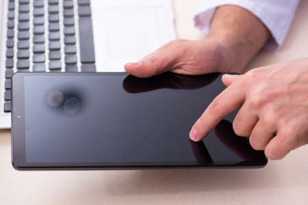 Young male doctor in telemedicine concept
