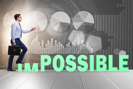 Businessman in impossible business conceptの写真素材