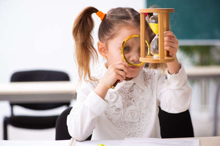 Small girl in time management concept