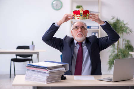 Old king businessman employee at workplaceの写真素材