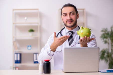 Young male doctor working in the clinicの写真素材
