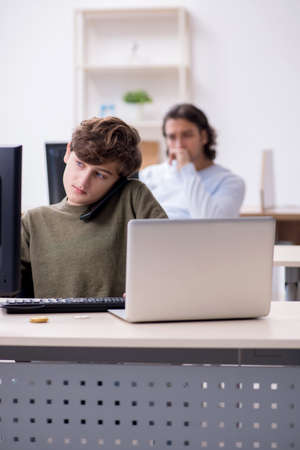 Father and son in it conceptの写真素材