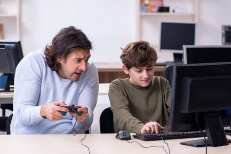 Father and son playing computer games