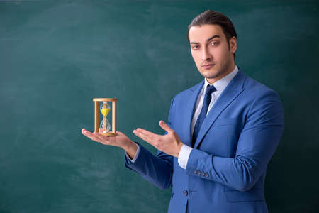 Young man employee in business presentation concept