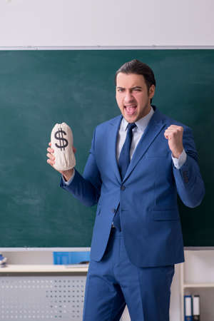 Young man employee in business presentation conceptの写真素材