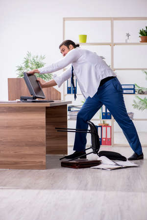 Young male employee businessman at workplaceの素材 [FY310153574722]